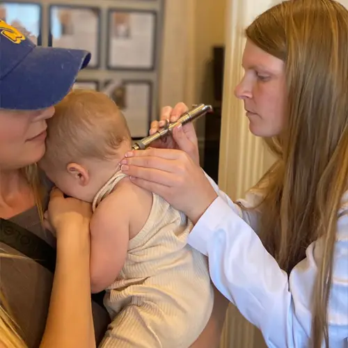 Chiropractor-San-Antonio-TX-McKenzie-Slattery-Checking-Patient-Neck