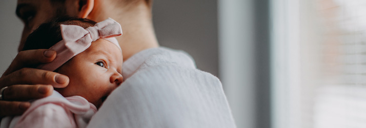 Parent-Holding-Newborn-Baby