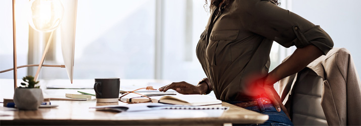 Woman-at-Desk-Lower-Back-Pain