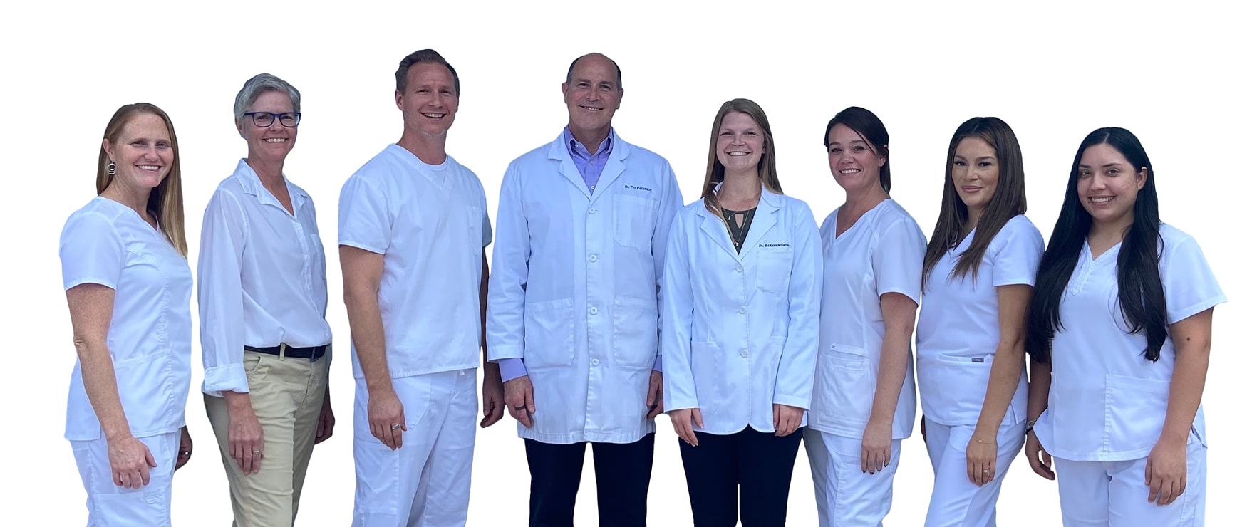 Peterson Chiropractic team all in white smiling for a photo